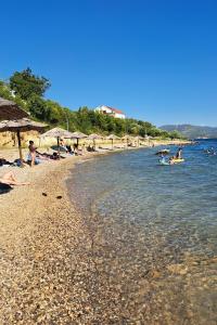 a group of people swimming in the water at a beach at Family friendly house with a swimming pool Maslenica, Novigrad - 24641 in Maslenica +23 photos