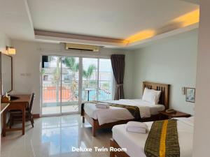 Katil atau katil-katil dalam bilik di That Phanom River View Hotel