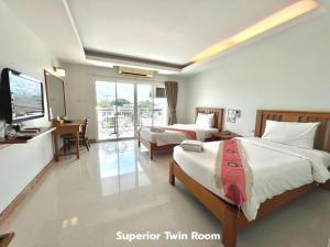 Katil atau katil-katil dalam bilik di That Phanom River View Hotel