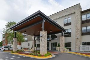 a rendering of a building with a pavilion at Holiday Inn Express & Suites Raleigh NE - Medical Ctr Area by IHG in Raleigh