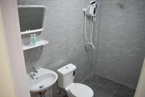 a bathroom with a white toilet and a sink at Fandee suites in Ban Sa Kut +30 photos