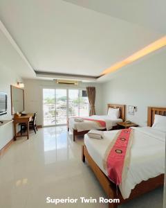 Katil atau katil-katil dalam bilik di That Phanom River View Hotel