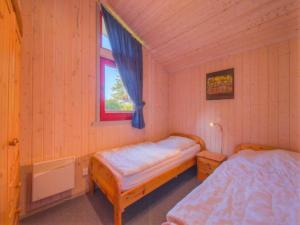 Postel nebo postele na pokoji v ubytování Ferienhaus mit Sauna im Ferienpark Mirow