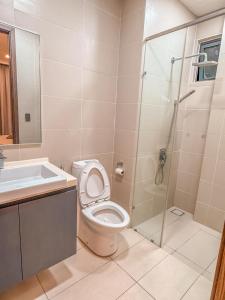 a bathroom with a shower and a toilet and a sink at Starry C13 at Green Haven 2Bedroom 2 Bathrooms in Masai