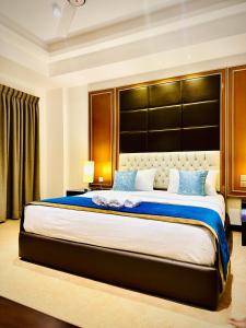 a bedroom with a large bed with a large headboard at Sea view Serenity Negombo in Negombo