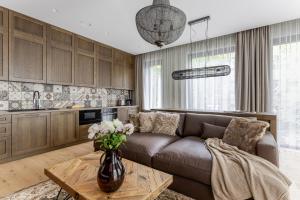 a living room with a couch and a table at Luxury apartment in the city center Nr3 in Kaunas