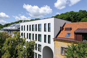 a white building with a red roof at Luxury apartment in the city center Nr3 in Kaunas