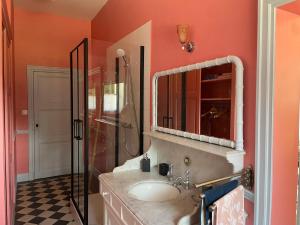 a bathroom with a sink and a shower at Manoir Mer & Pins in Fouesnant