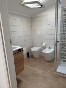 a bathroom with a tub and a sink and a toilet at B&b da Chiazza in Cicala +9 photos