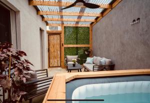 a house with a swimming pool and a patio at Up the Hill in Tiberias