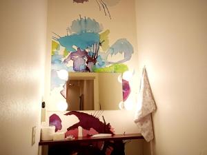 a bathroom with a mirror with a dragon on the wall at 女性専用ゲストハウス-Female only Guesthouse-Travel Stay UTSUNOMIYA in Utsunomiya