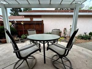 a table and chairs on a patio at Modern Folsom Family Home Near Trails & Shopping in Folsom