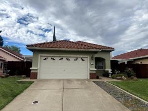 a white garage door in a house with a steeple at Modern Folsom Family Home Near Trails & Shopping in Folsom +43 photos