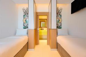Uma cama ou camas num quarto em Fuwairit Kite Beach, Tapestry Collection By Hilton