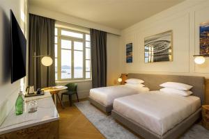 Postel nebo postele na pokoji v ubytování Hyatt Regency Zadar
