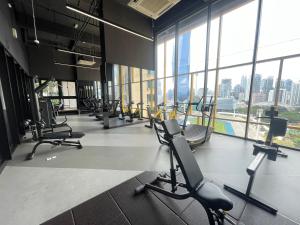 a gym with rows of chairs and a large window at Blue Haven Apartment at Opus Residence Kuala Lumpur in Kuala Lumpur