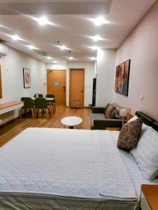 Un pat sau paturi într-o cameră la Căn hộ TMS Quy Nhơn +6 fotografii