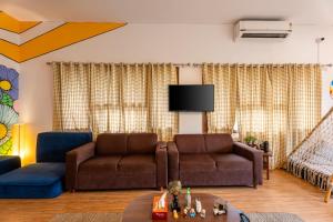 Posezení v ubytování Whiite Panda - Backpacker Hostel in Delhi Greater Kailash
