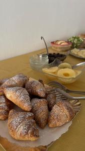 a bunch of pastries sitting on a table at Hotel CARLO in Riccione