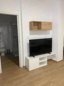 a living room with a flat screen tv on a wall at PET FRIENDLY Casita Marín in Santa Pola