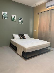 Ένα ή περισσότερα κρεβάτια σε δωμάτιο στο Green Village Resort