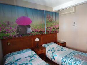 Кровать или кровати в номере Hostal González