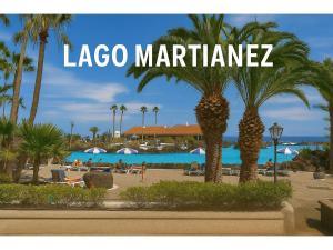 a sign for lagos marina with palm trees on a beach at Fantastico 1 - Balcony, free parking, air conditioning, free Netflix, BBQ in Puerto de la Cruz +19 photos