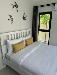 a bedroom with a bed with three bats on the wall at Casa Itkı in Ortaca +19 photos