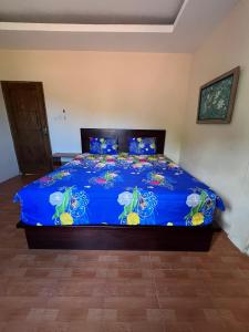 Ένα ή περισσότερα κρεβάτια σε δωμάτιο στο Srimatu Kuta Lombok