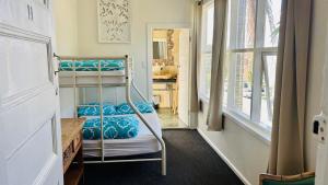 a bedroom with two bunk beds in a room at Keiraleagh House in Wollongong
