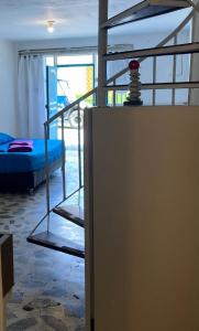 a room with a bunk bed and a bunk ladder at Jardín Aventura in Jardin