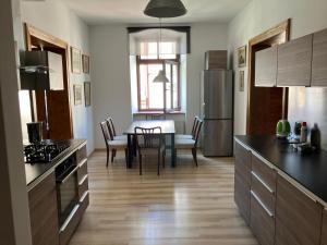 a kitchen with a table and a dining room at Apartament Głęboka 19 in Cieszyn