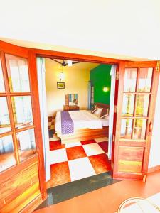 Postel nebo postele na pokoji v ubytování WAYANAD RESORT VILLA Service