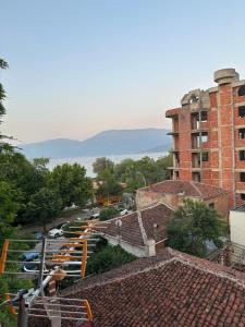 a view of a city with cars parked in a parking lot at Vila Elio in Pogradec