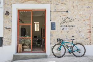 a blue bike parked in front of a building at Vento Forte - eco dimore nel borgo in Civita