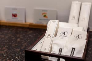 a box of nintendo wii controllers sitting on a counter at Alaya Stays 2 BHK with Balcony & Lift - Veera Marina in Goa +212 photos