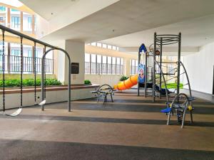 a playground in a building with a slide at Paradigm Residence 10Pax 3R Lv25 in Johor Bahru