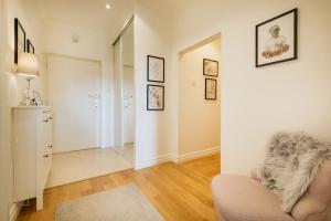 a living room with a couch and a mirror at 4SONS UMAG Sea View 2BR Apartment in Town center !NEW! in Umag +32 photos