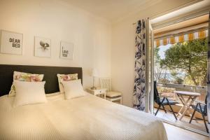 a bedroom with a large bed and a window at 4SONS UMAG Sea View 2BR Apartment in Town center !NEW! in Umag