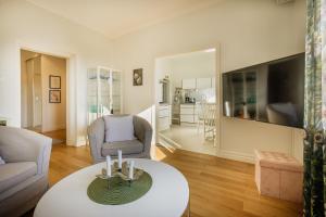 a living room with a couch and a table at 4SONS UMAG Sea View 2BR Apartment in Town center !NEW! in Umag