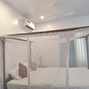 Postel nebo postele na pokoji v ubytování Kate's Cottages + 10 fotografií