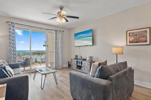 a living room with a couch and a table at Ariel Dunes II 703 in Destin