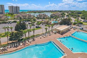 an overhead view of two pools in a resort at Ariel Dunes II 703 in Destin