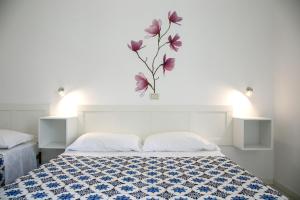 A bed or beds in a room at Residence Villa Ofelia