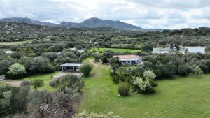 an aerial view of a house in a field at Exclusive Villa Aurea with private pool in Cugnana