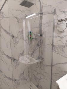 a bathroom with a shower with a sink at Natasa's Appartment in Kalamata in Kalamata