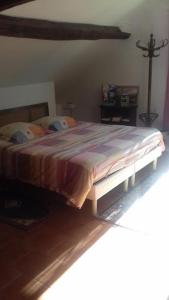 Postel nebo postele na pokoji v ubytování Le Manoir des Prés