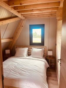 Ένα ή περισσότερα κρεβάτια σε δωμάτιο στο chalet laguiole-aubrac