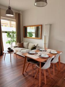 a living room with a table and a couch at StayHub-RHO in Rho
