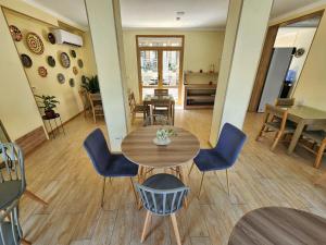 a dining room with a table and chairs at Oasis Boutique in Bukhara